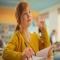 A girl in school, raising her hand